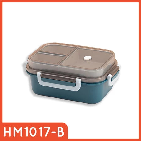 Kotak makan siang satu tingkat berwarna teal dengan tutup transparan berwarna abu-abu gelap, yang dilengkapi sekat internal dan lubang uap, serta klip pengunci samping berwarna putih dengan aksen abu-abu tua.