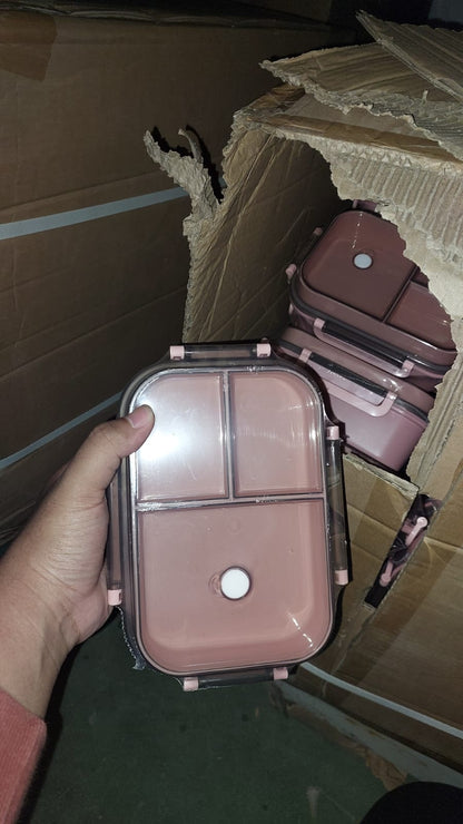 Compact makeup case held by a hand with cardboard boxes in the background