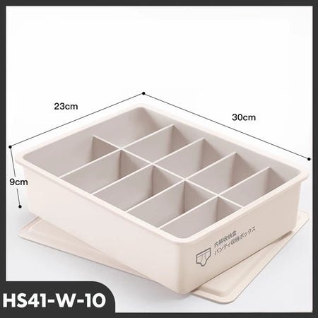 Tampilan tiga perempat dari organizer laci model HS41-W-10 berwarna krem atau putih gading dengan 10 kompartemen terpisah dan penutupnya di bawah. Dimensi produk terlihat jelas: panjang 30cm, lebar 23cm, dan tinggi 9cm. Terdapat ikon celana dalam dengan teks Mandarin/Jepang di sisi kotak, menunjukkan fungsinya untuk menyimpan pakaian dalam atau kaus kaki."