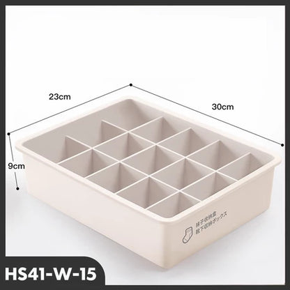 Tampilan tiga perempat dari organizer laci model HS41-W-15 berwarna krem atau putih gading dengan 15 kompartemen terpisah dan penutupnya di bawah. Dimensi produk terlihat jelas: panjang 30cm, lebar 23cm, dan tinggi 9cm. Terdapat ikon kaus kaki dengan teks Mandarin/Jep