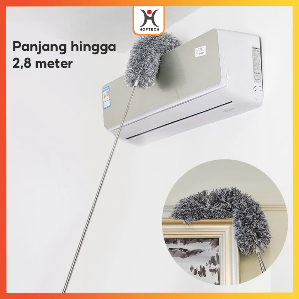 A gray microfiber duster with a flexible head being used to clean the top of an air conditioner and reaching into tight corners. The duster has an extendable handle.