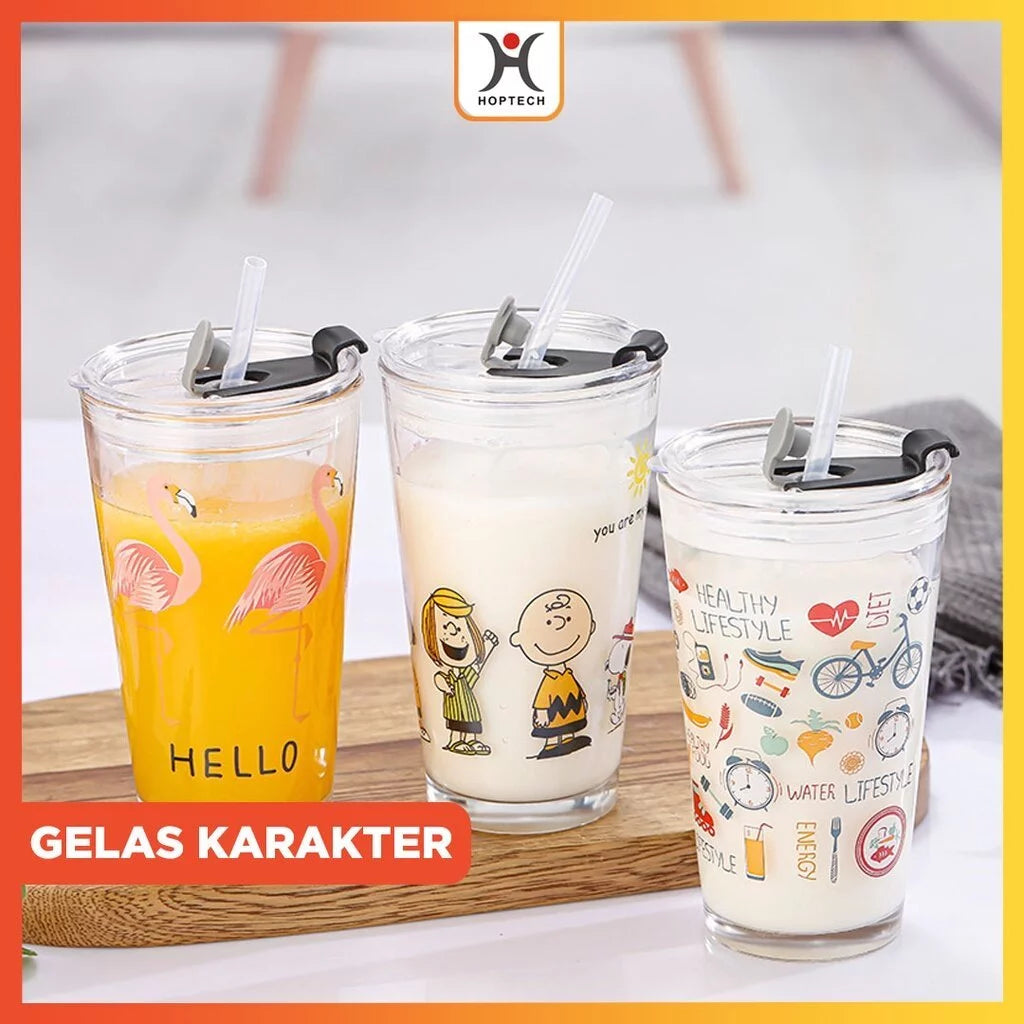 A set of three glass tumblers with character designs, each with a clear glass body and a plastic lid, accompanied by a silicon straw.