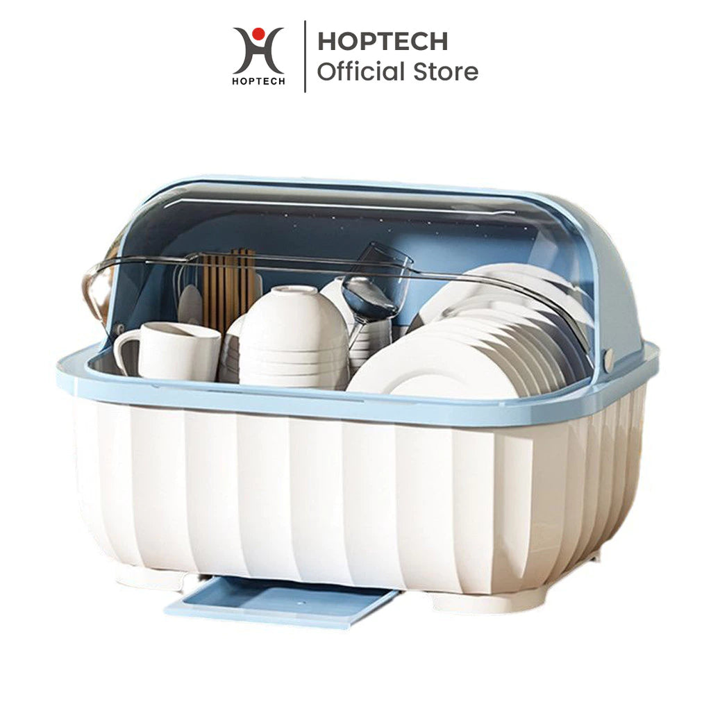 A white plastic dish drying rack with a transparent blue lid, filled with various kitchenware such as plates, cups, and utensils.